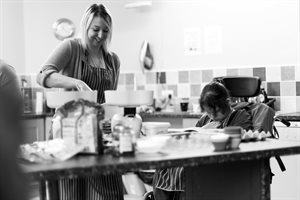 Woman laughing and baking